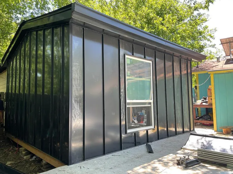 Black standing seam metal wall panels for Roof Inspection in Ivins